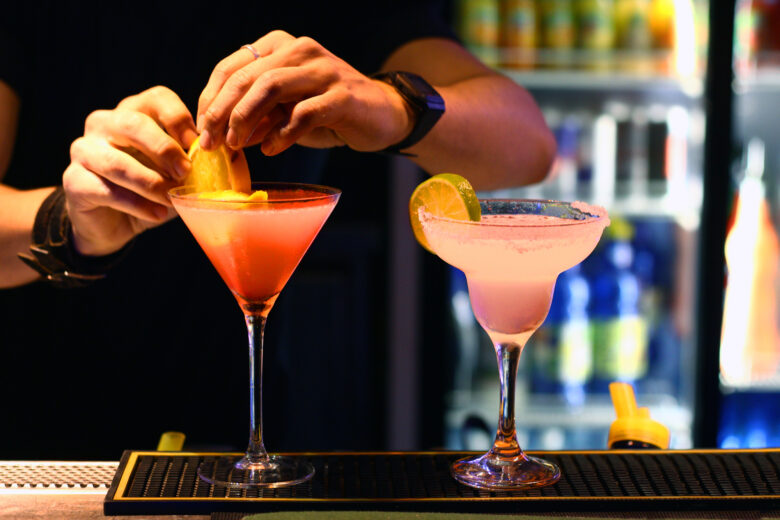 Barmen is making cocktails